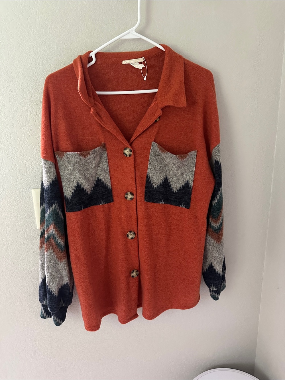 Rust Orange Button-Up Cardigan with Patterned Pockets and Sleeves